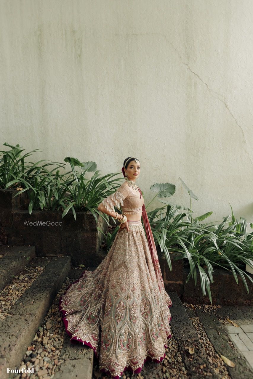 Photo of Gorgeous Tarun tahiliani lehenga with a statement blouse with tassels