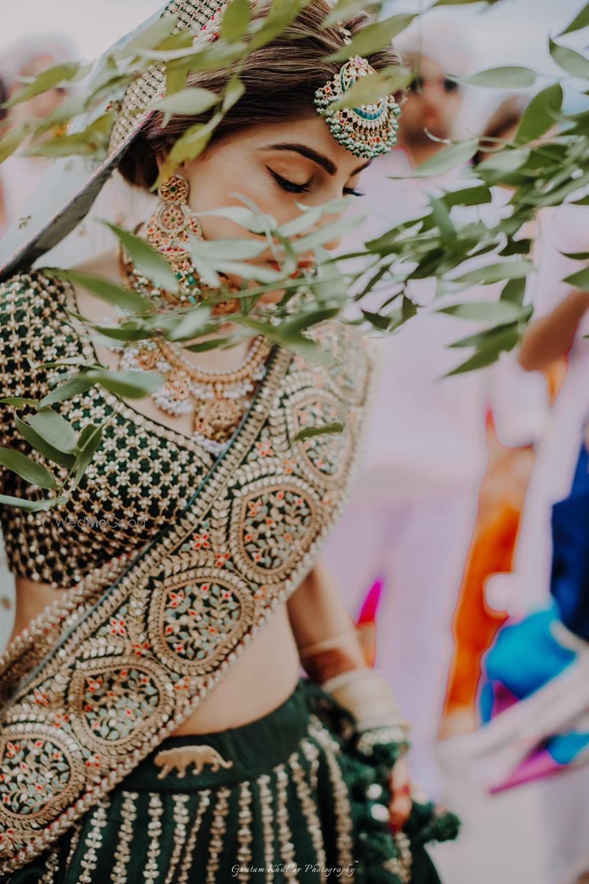 Photo of Offbeat bridal lehenga with bride wearing belt