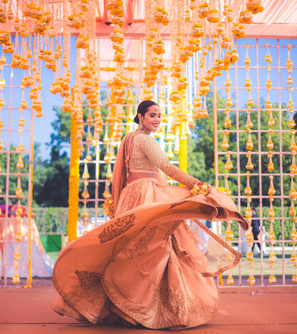 Photo of Twirling bride shot showing off lehenga