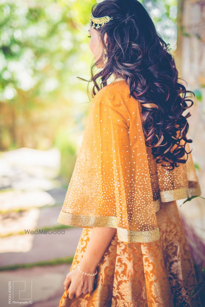 Photo of Mustard mehendi lehenga with cape