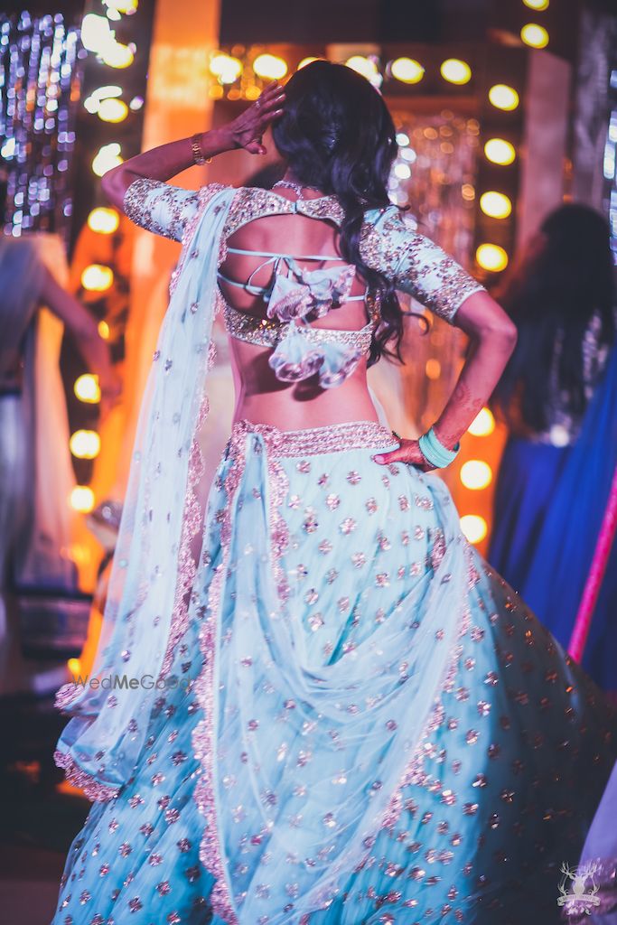 Photo of Girly engagement lehenga with unique blouse back style