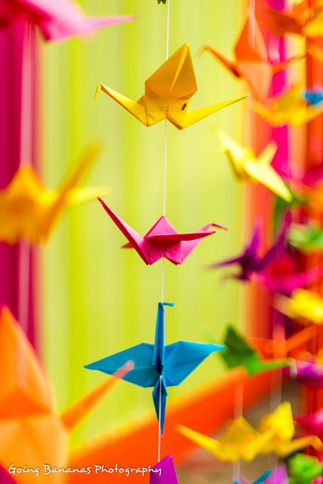 Photo of paper origami cranes made to provide a backdrop of the vedi