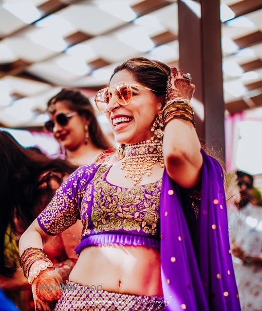 Photo of Mehendi jewellery with purple lehenga happy bride