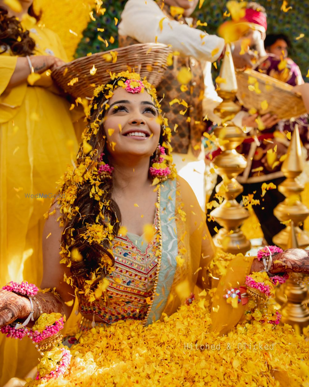 Photo of flower shower on bride on haldi