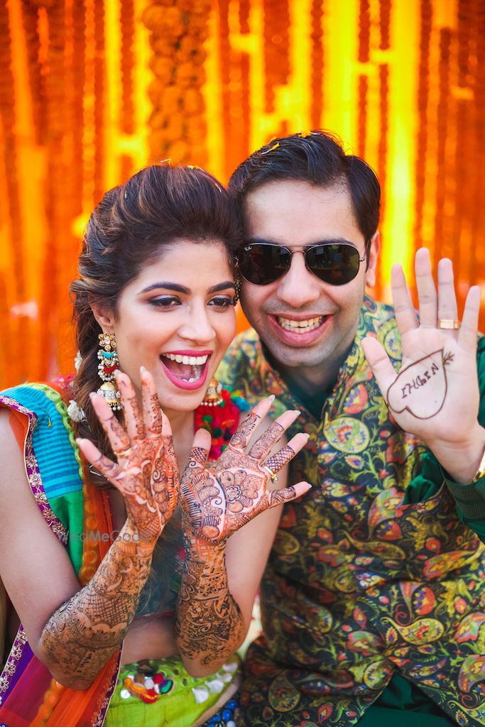 Photo of Cute bride and groom mehendi