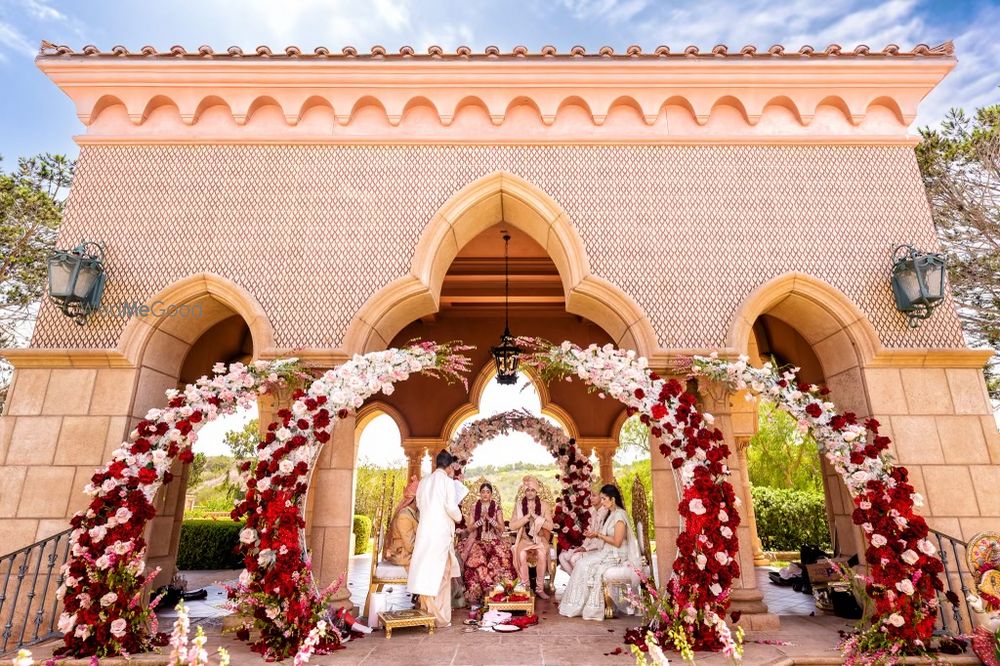 Photo of unique circular floral mandap idea with maroon and white flowers