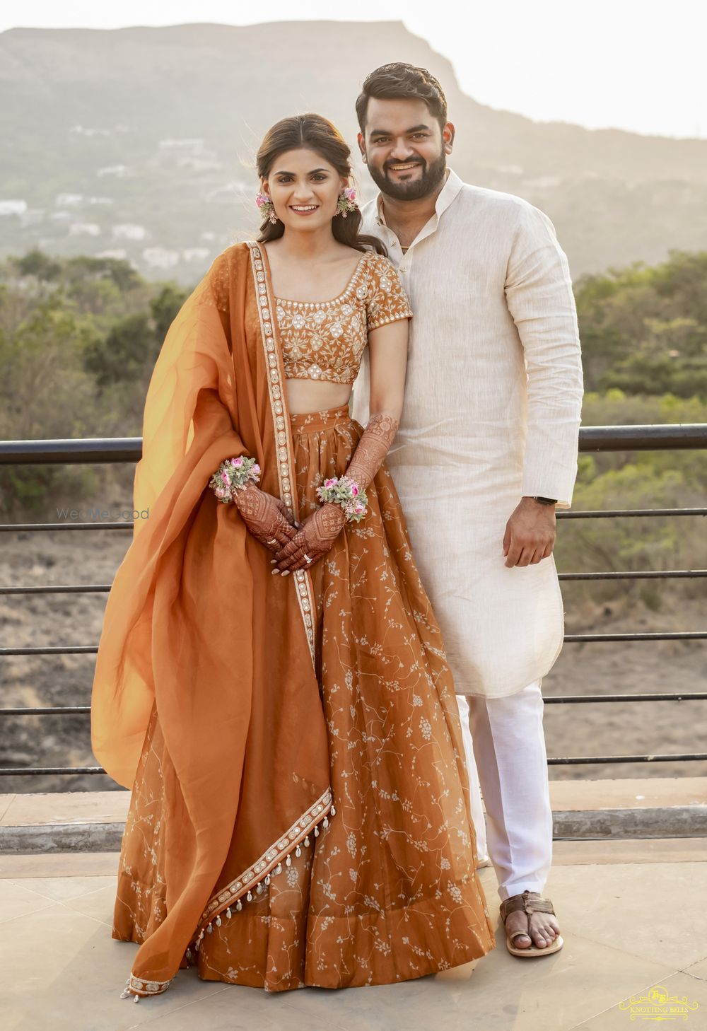 Photo of Couple posing at their Haldi ceremony.