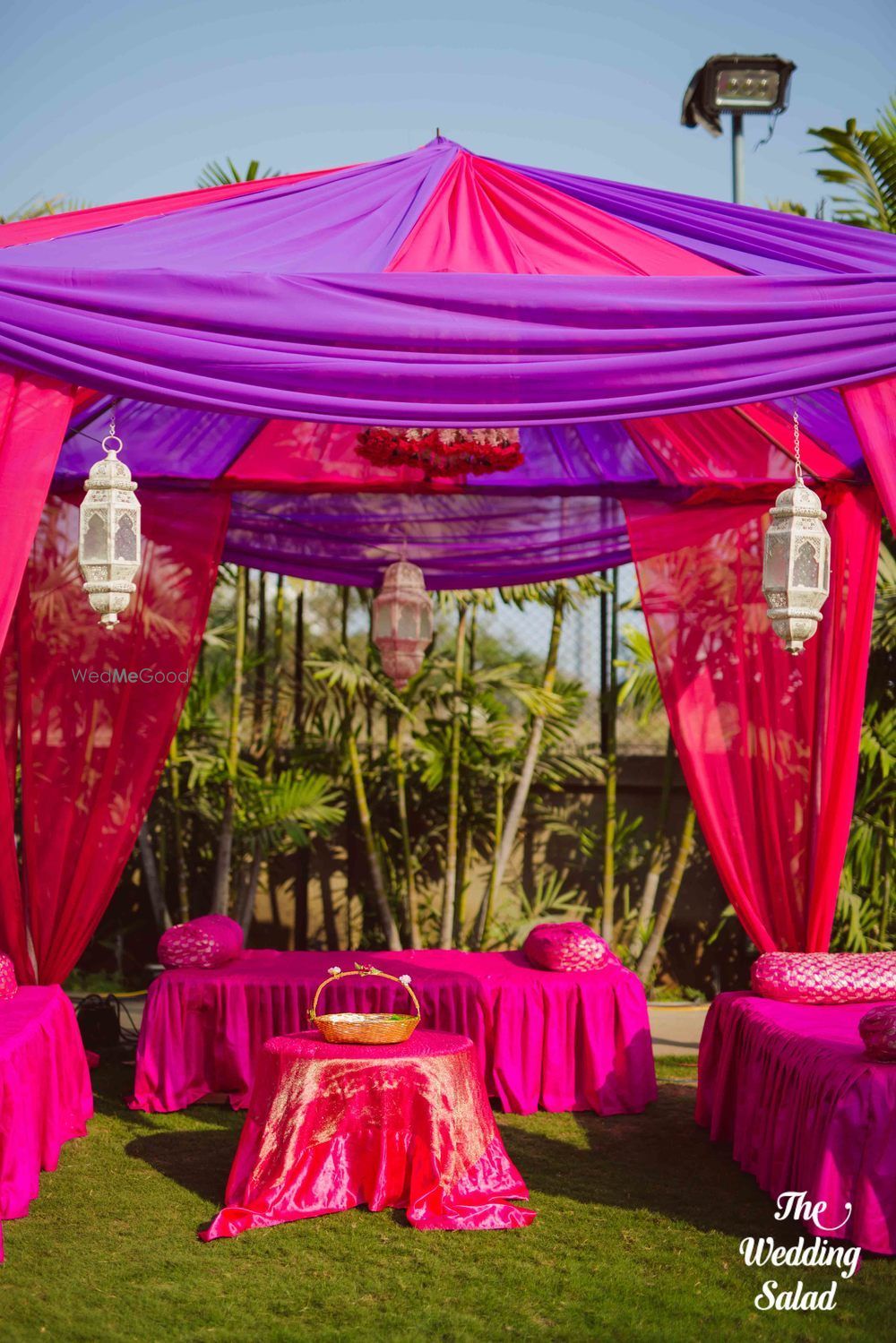 Photo of Mehendi decor idea with pink and purple tents and theme