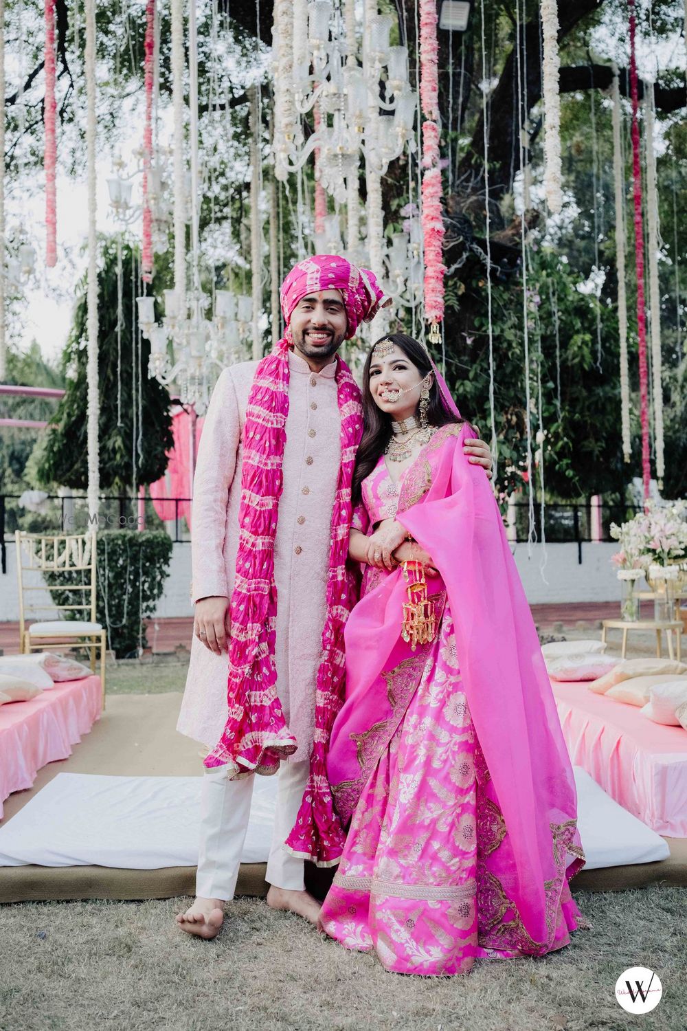 Photo of bride and groom in matching outfits for their minimal wedding at home