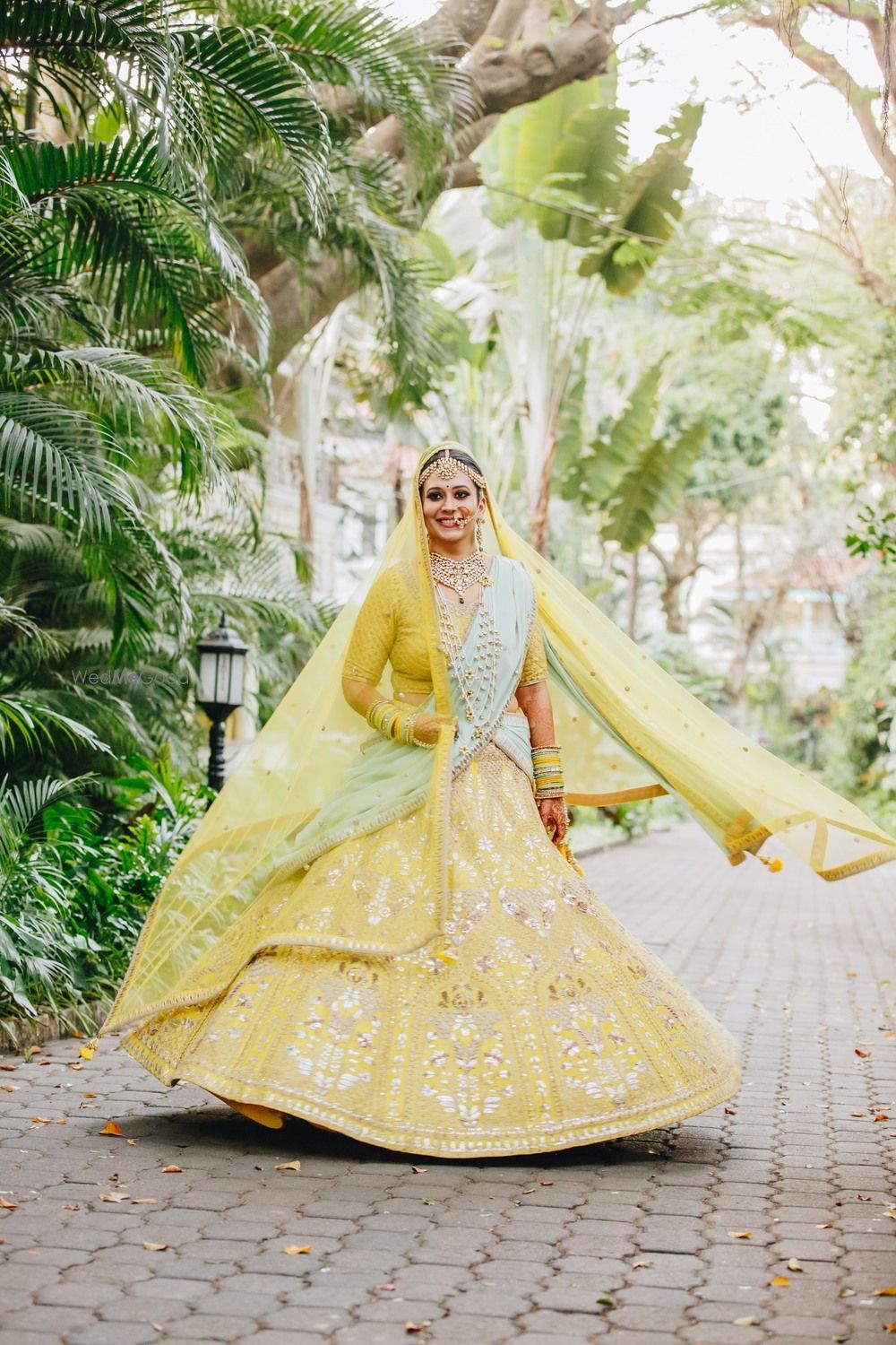 Photo of Offbeat bridal lehenga in yellow and mint colours