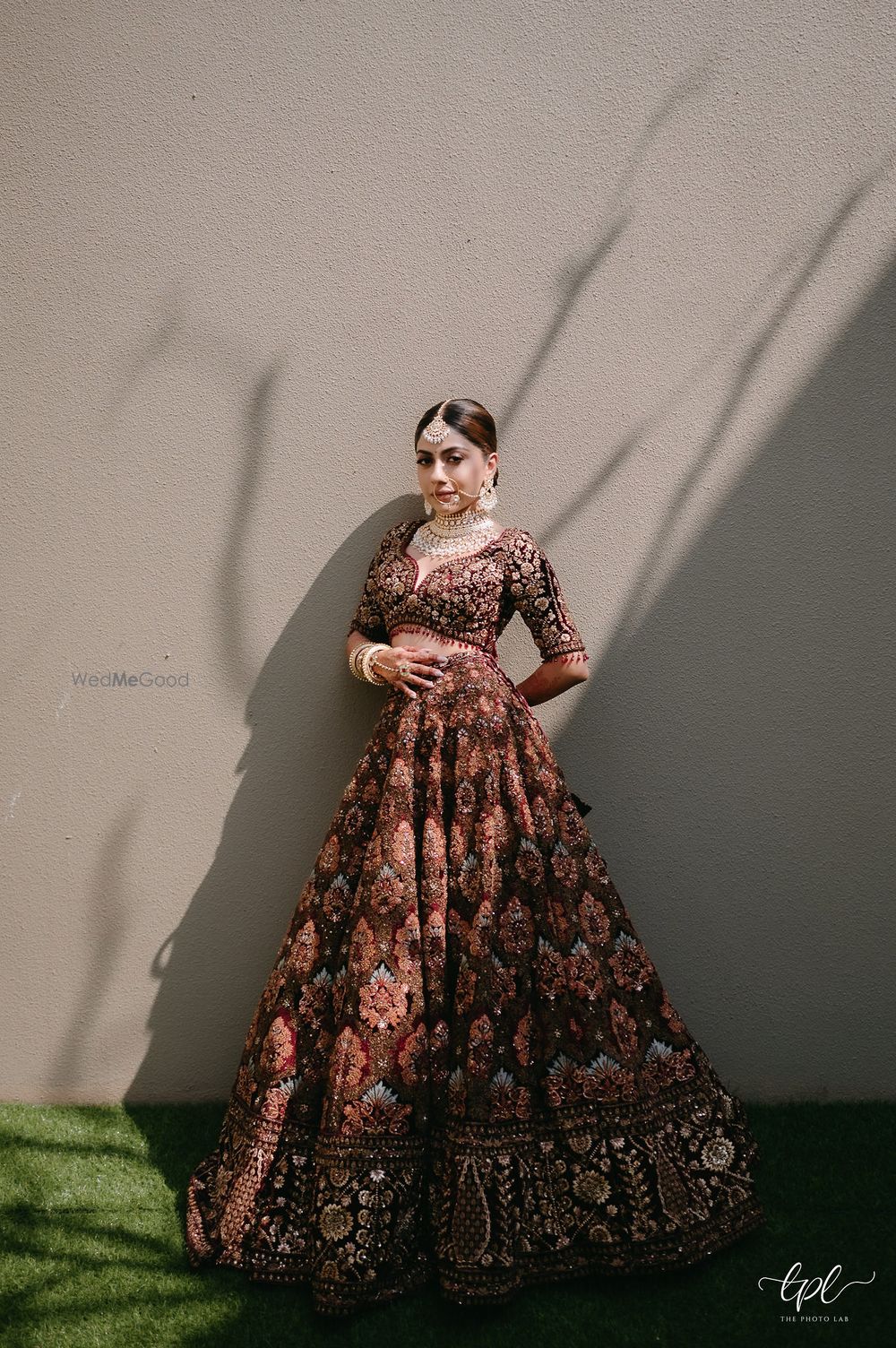 Photo of Stunning bridal lehenga shot in brown and peach hues and beautiful bridal jewellery