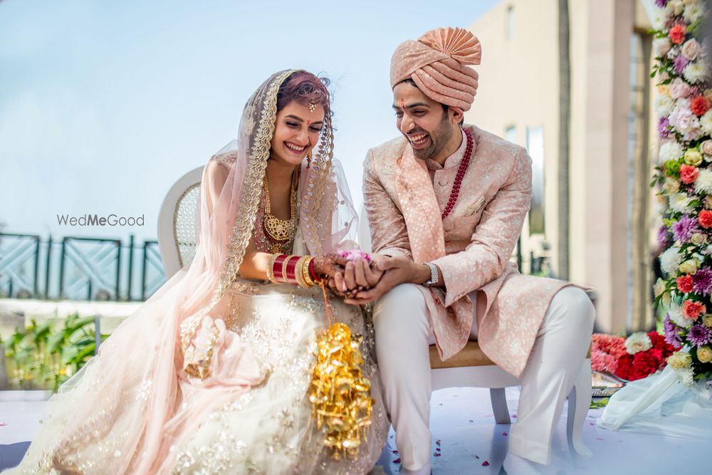 Photo of The bride and groom at the pheras, smiling and laughing!