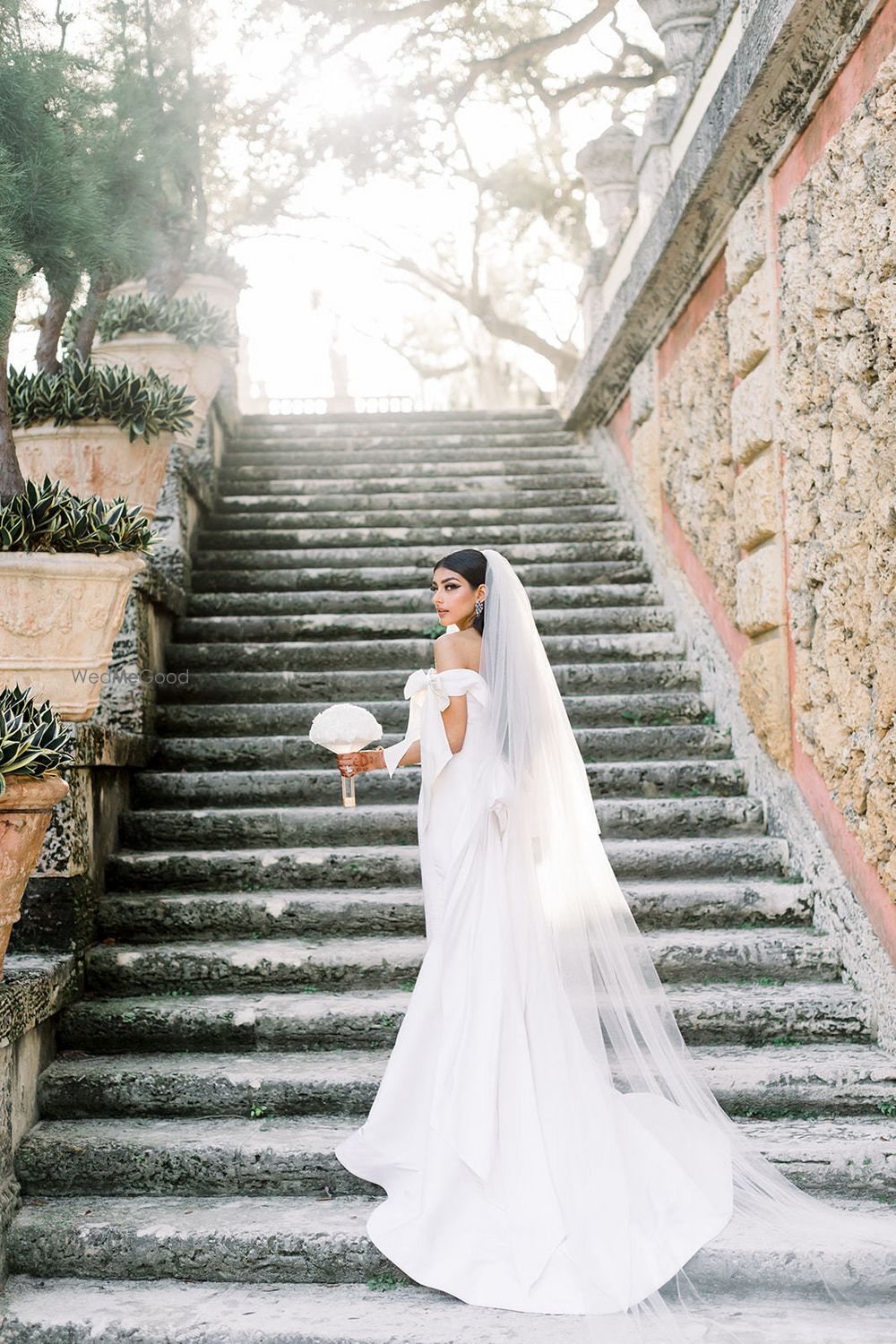 Photo of Long wedding gown with train and veil