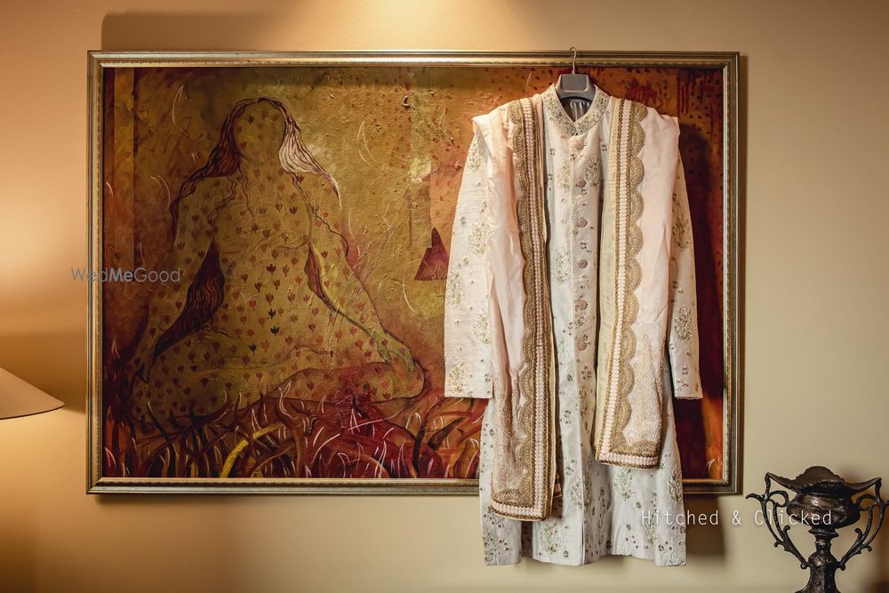 Photo of pastel sherwani on hanger with stole