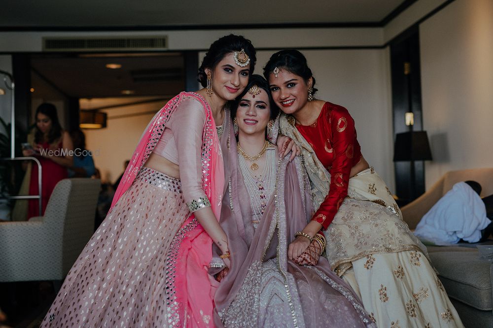 Photo of The bride with her sisters right before she ties the knot