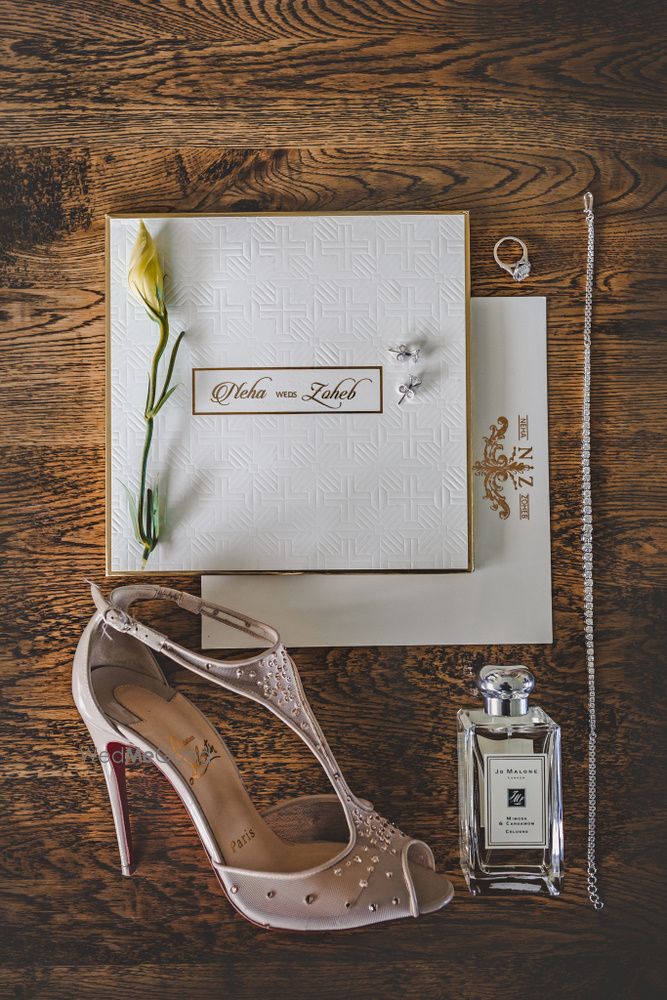 Photo of Bridal accessories with perfumes and heels