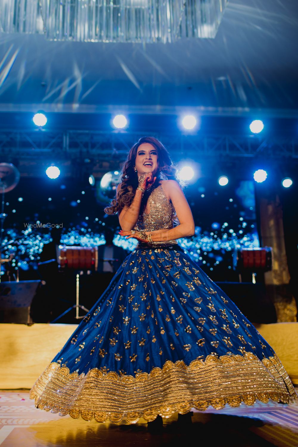 Photo of Happy bride dancing on sangeet shot