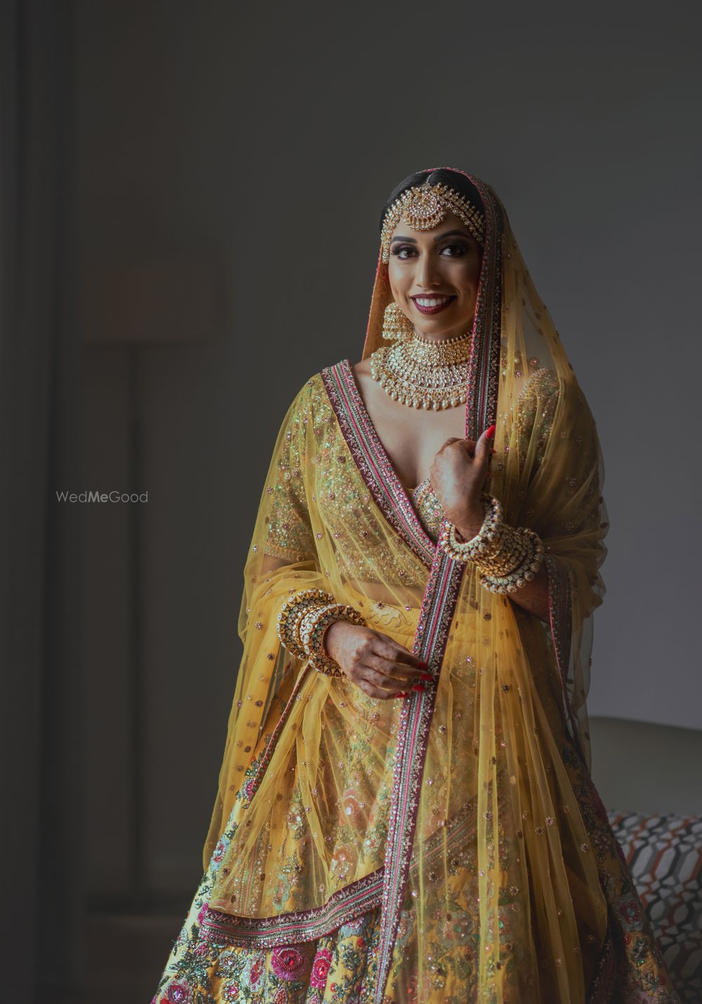 Photo of bride in an offbeat yellow sabyasachi lehenga