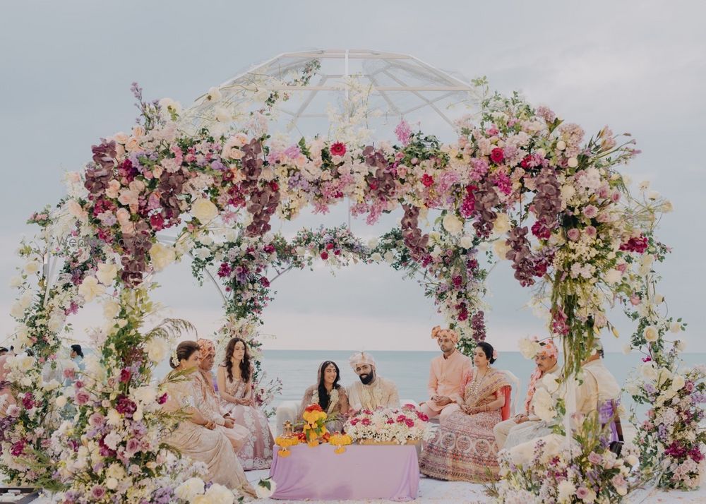 Photo of Gorgeous floral mandap with dome style outdoor decor in pink and pastel florals