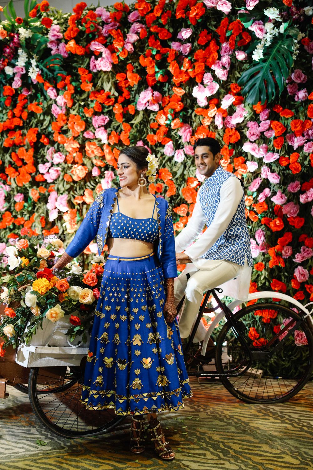 Photo of bride in lehenga with jacket on her mehendi day