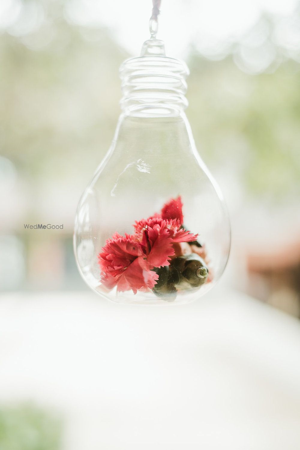 Photo of DIY decor idea with florals inside bulbs