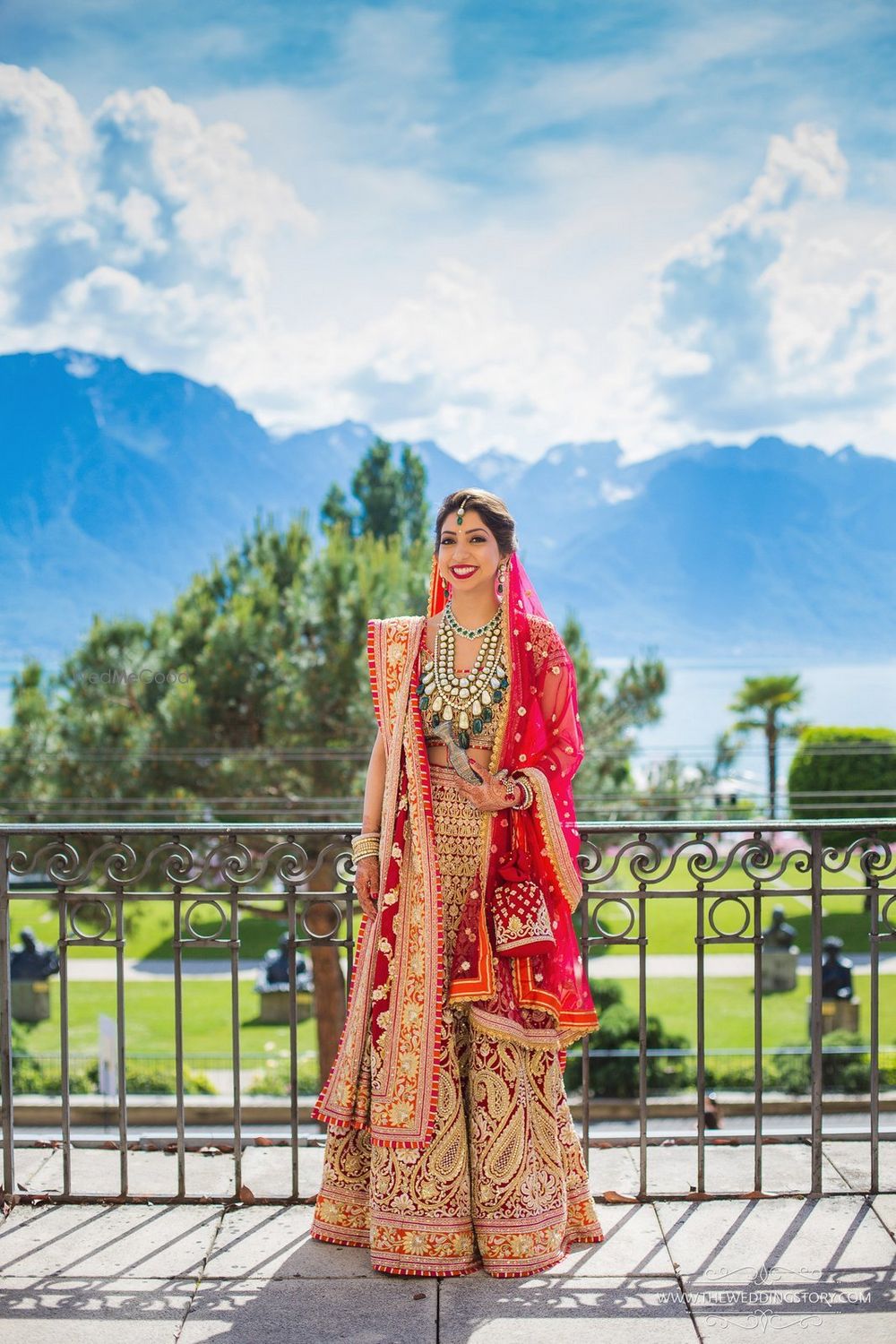 Photo of Bride in gorgeous red Abu Jani lehenga