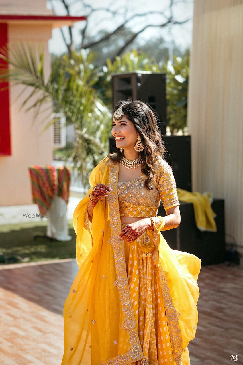 Photo of Bright yellow mehendi lehenga