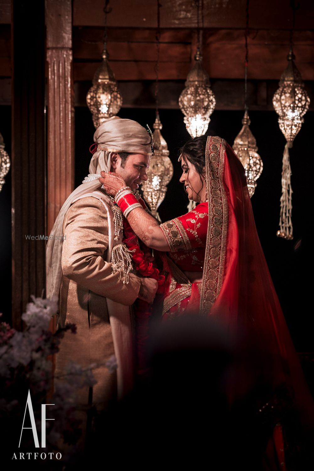 Photo of Bride putting jaimala on groom shot