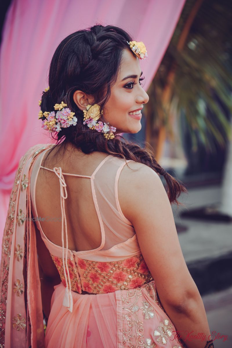 Photo of Mehendi look with floral braided hair