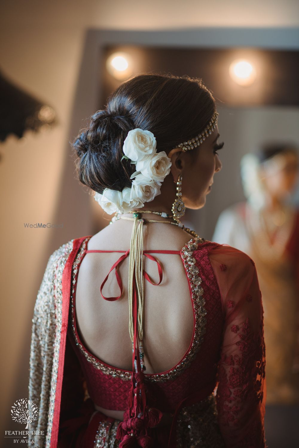 Photo of Bridal back shot with white roses in bun