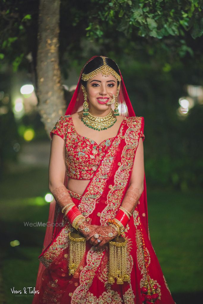 Photo of Red embroidered lehenga with blue threadwork