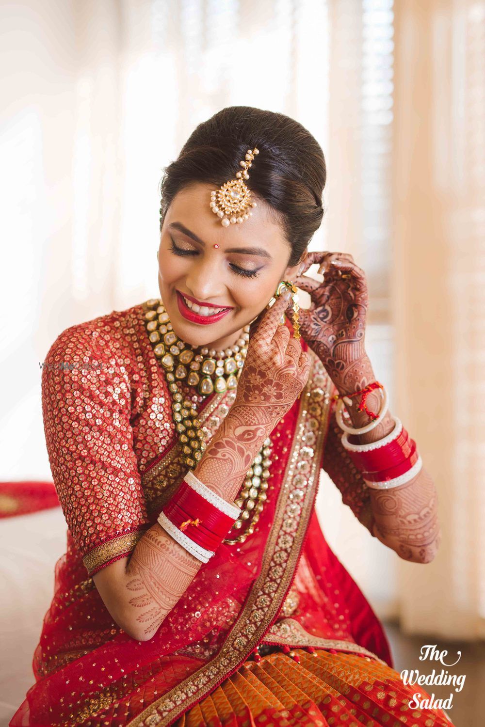 Photo of Bride getting ready shot wearing earrings