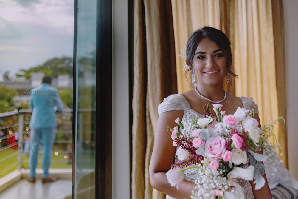 Photo of A Christian bride holding a floral bouquet