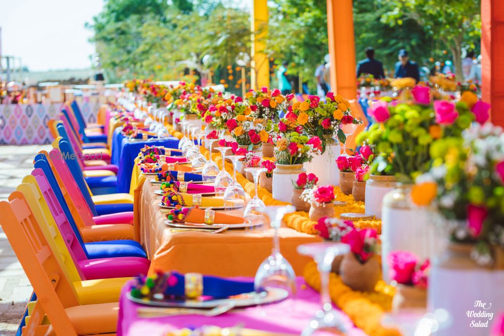 Photo of colourful mehendi decor idea with pickle jars as centrepieces