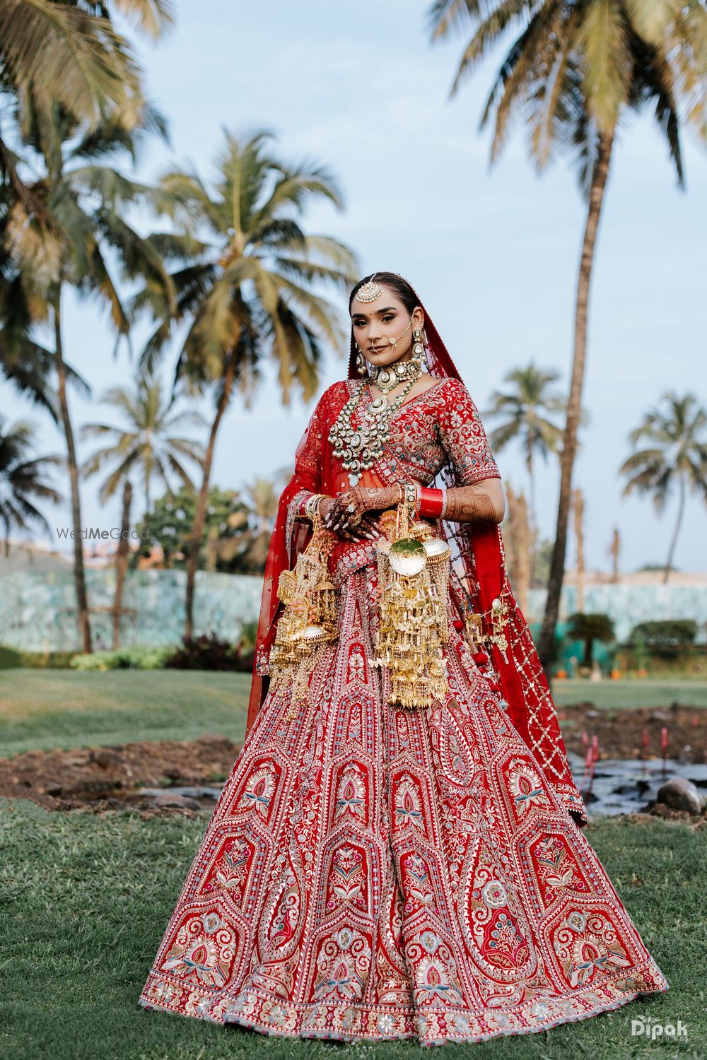 Photo of bride in red lehenga