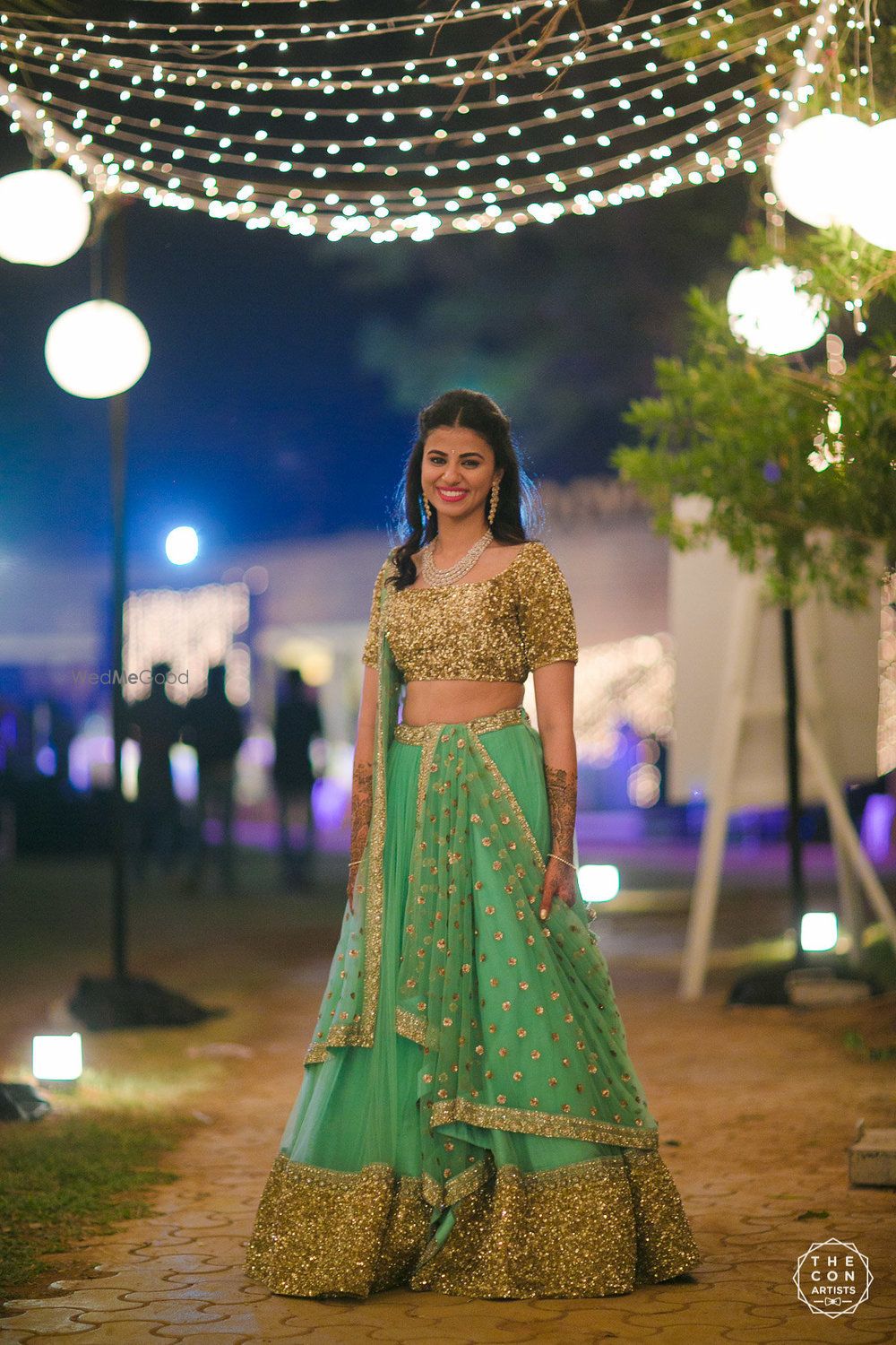 Photo of Gold and green sparkly lehenga