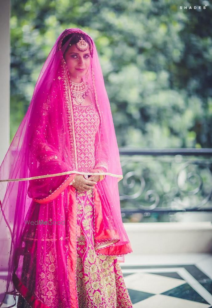 Photo of fuschia pink bridal outfit