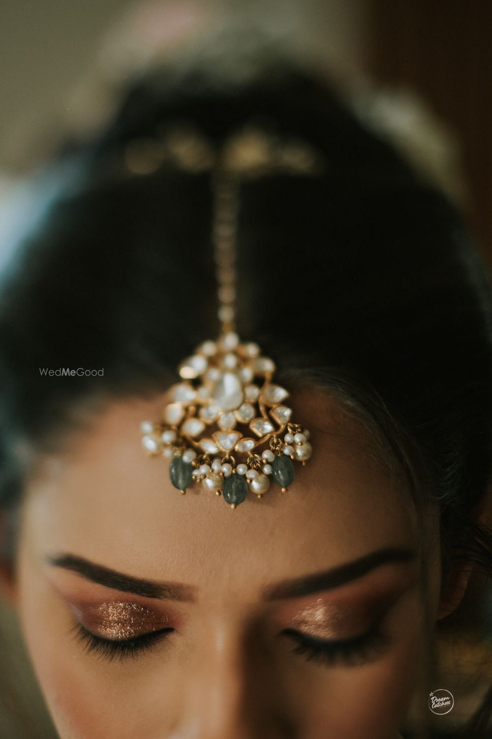 Photo of white and green bridal maangtikka