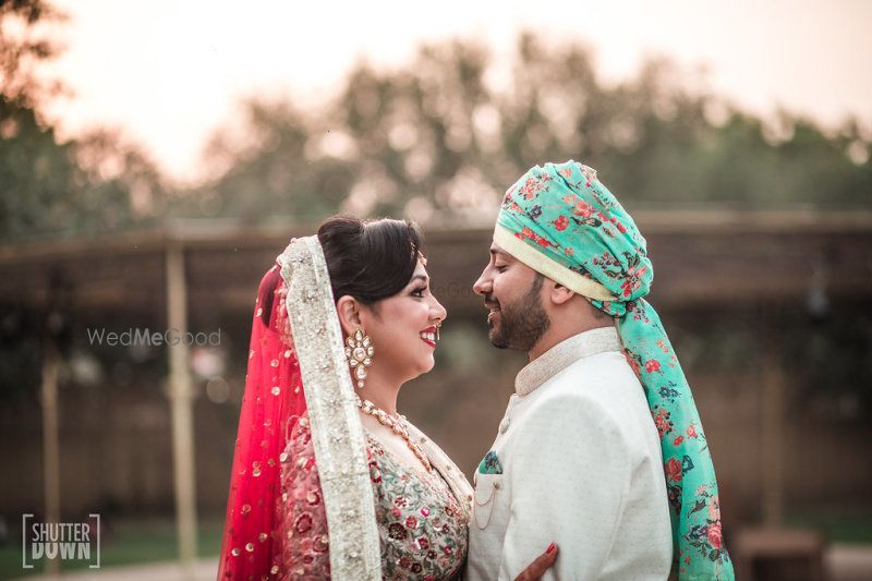 Photo of Floral safa for groom in turquoise