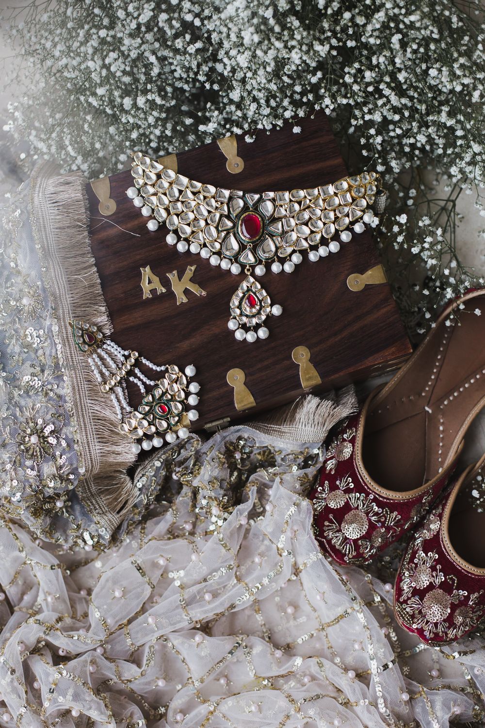 Photo of Gorgeous shot of bridal jewellery and juttis