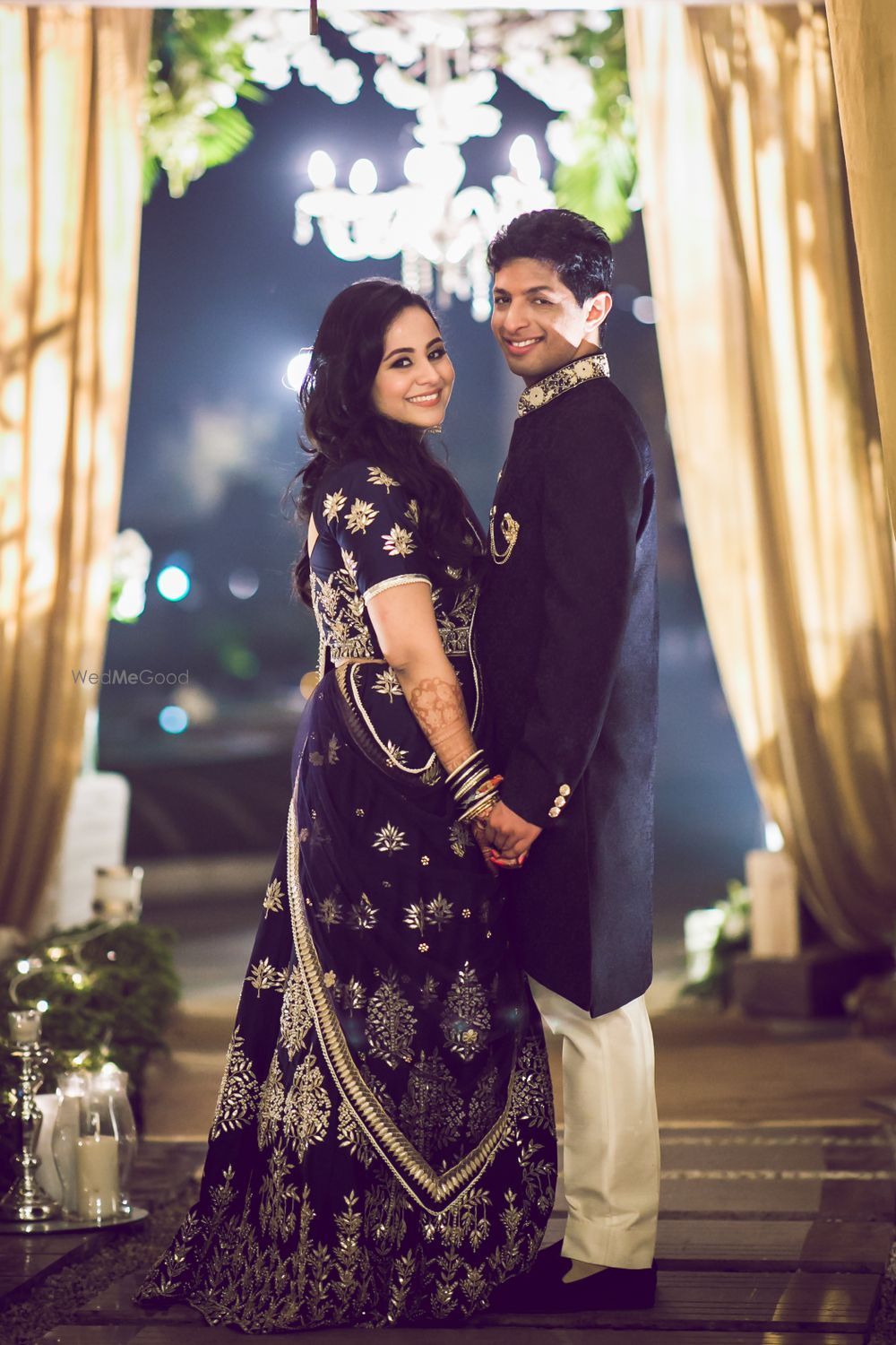 Photo of A cute couple portrait in colour-coordinated outfits.