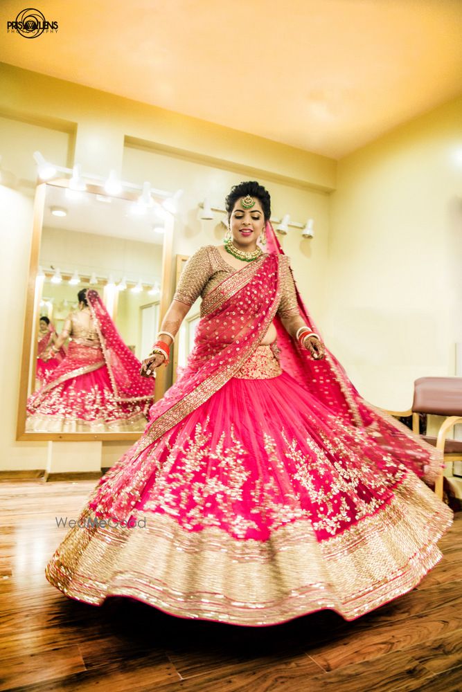 Photo of twirling bride