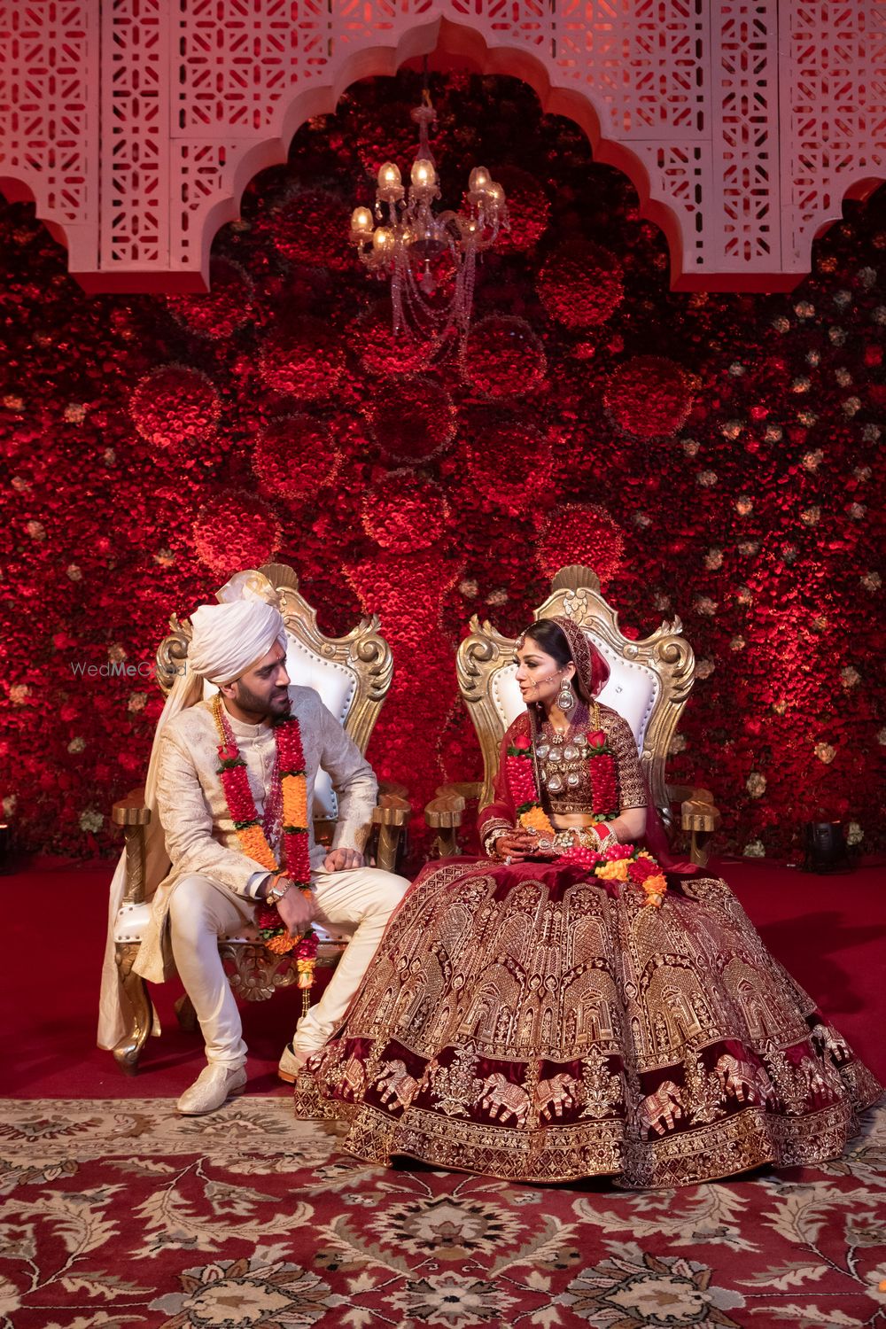 Photo of The bride and groom captured in a candid pose during the wedding