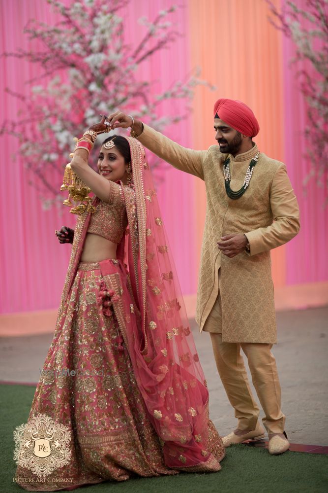 Photo of Pink and gold bridal lehenga