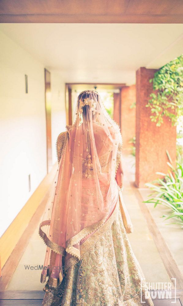 Photo of Peach and mint bridal lehenga