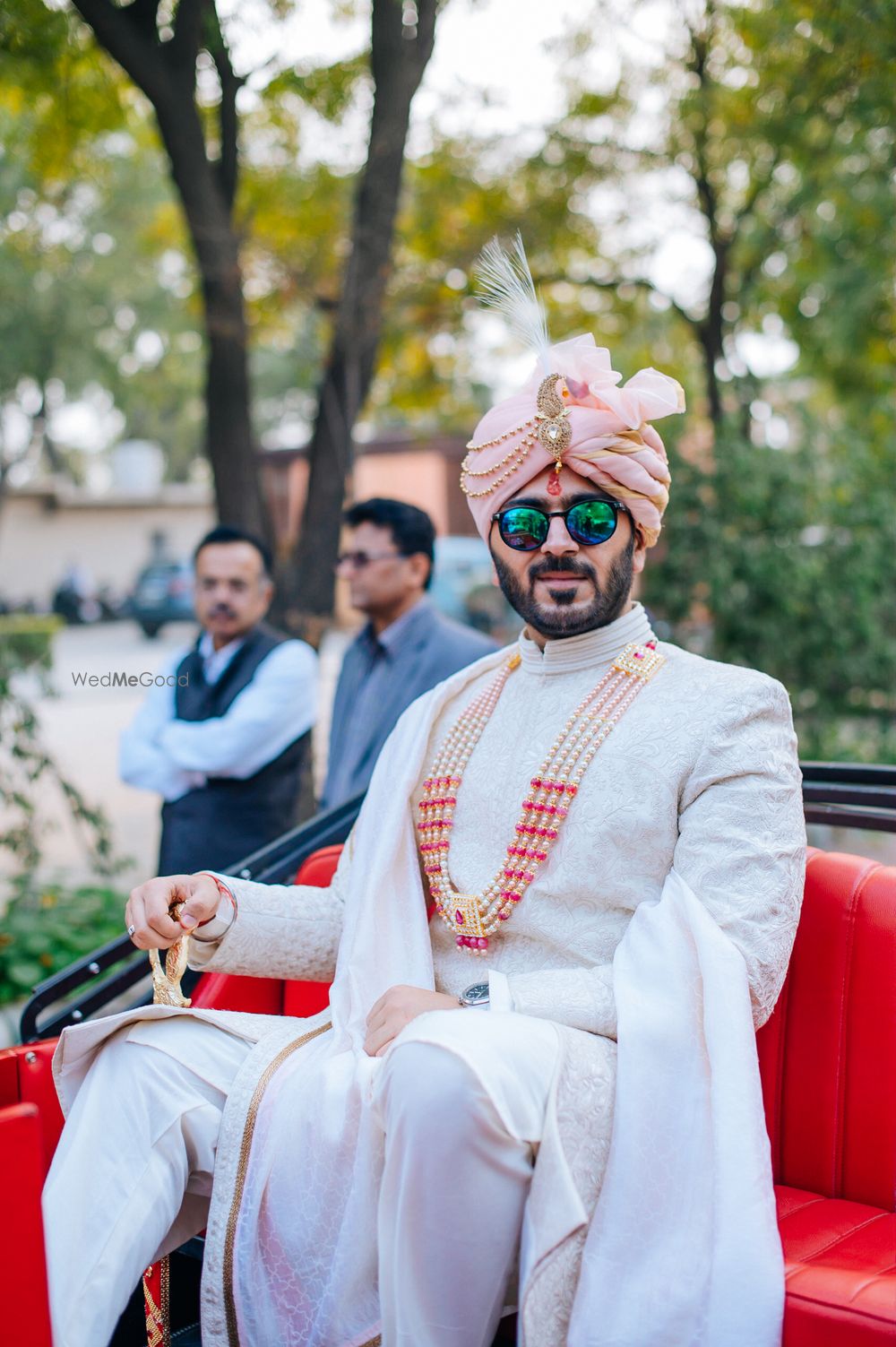 Photo of Groom looking dapper in an ivory sherwani.