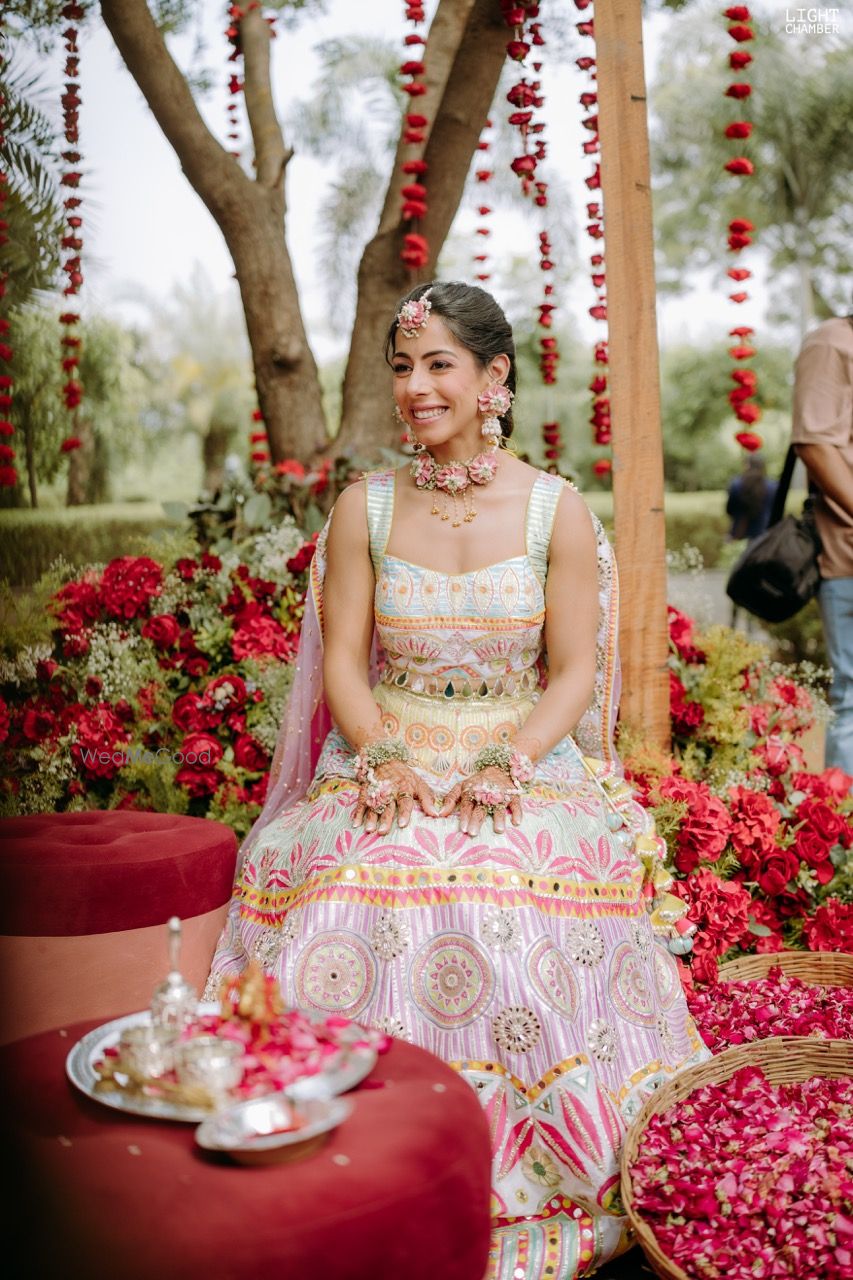 Photo of bride in pastel lehenga