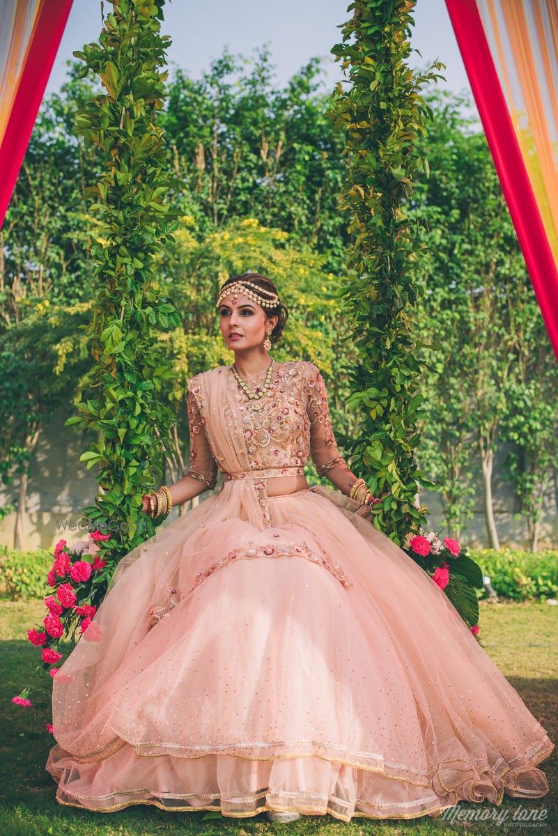 Photo of Light pink lehenga on engagement