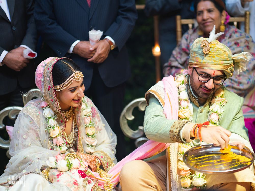 Photo of Sage green sherwani and unique jaimalas