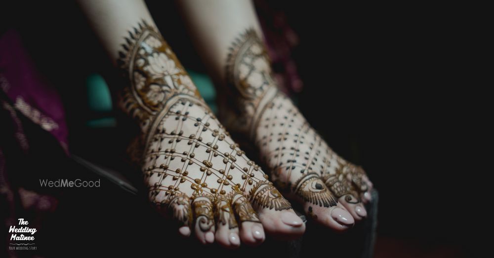 Photo of simple feet mehendi with evil eye motifs